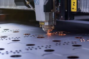 Laser,Machine,Cutting,Of,Sheet,Metal.,Sparks,Fly,From,Laser